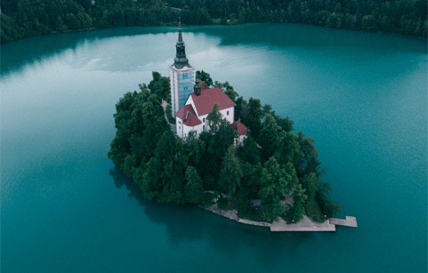 Sample shoot of bird's eye view of an island with a house on it.